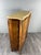 An elegant Louis XV style cabinet with marquetry veneer and rich floral decoration. The front features two wide, curved...