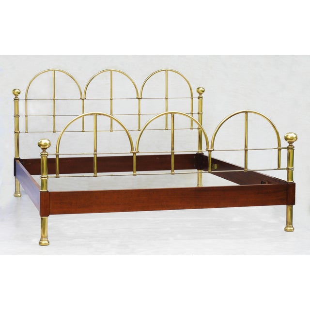 A striking custom-made Vintage Italian kingsize bedstead crafted in polished brass and wood. Combining classical elegance...