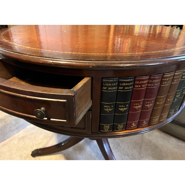 This leather top Drum table would be perfect for a library or living room that fits the style. It is in the style of the...