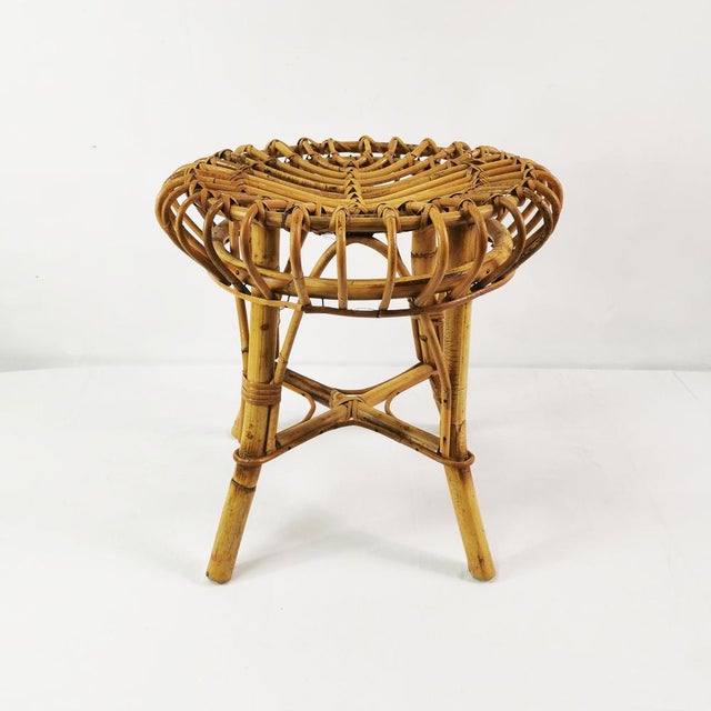 This stool originated in Italy in the 1960s and was designed by Franco Albini. Made of rattan and bamboo, it features a...