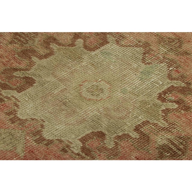 Made with hand-knotted wool, this 1x3 gift-sized vintage Turkish rug originating circa 1950-1960, is from the collection...