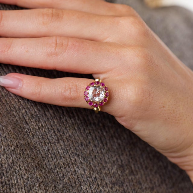 This exceptional Retro cluster ring is a striking jewel from the 1940’s, centered by a GIA-certified cushion brilliant cut...