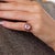 This exceptional Retro cluster ring is a striking jewel from the 1940’s, centered by a GIA-certified cushion brilliant cut...
