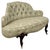 A beautifully proportioned 19th-century English Victorian settee, finely constructed in mahogany and distinguished by its...