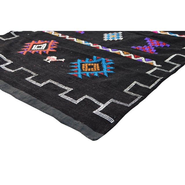 Berber kilim handwoven of cactus silk by the Berbers of Morocco's Atlas Mountains. Featuring diamond motifs and symbols of...