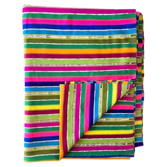 Offered is a vintage handwoven Guatemalan textile in brightly colored stripes with numerous joint bands of their jaspe...