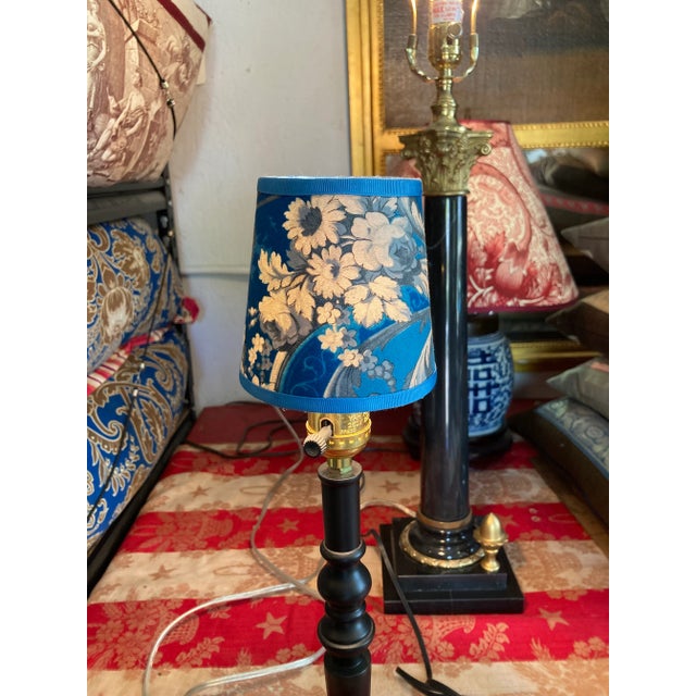 A pair of clip top chandelier shades hand made from antique French printed cotton. Measurements:top 3” bottom4” side 4”