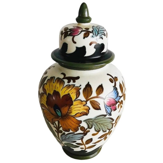 A large mid-century Royal Gouda Zuid-Holland covered vase/jar with a beautiful Verinique floral design from the 1950s. The...