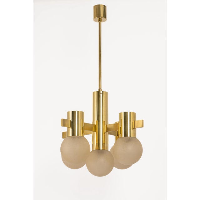 Five-light brass chandelier in the style of sciolari. The chandeliear features frosted glass in a very beautiful color....