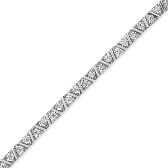 Bursting with classic elegance, this diamond tennis bracelet showcases slanted lines of polished .925 sterling silver that...