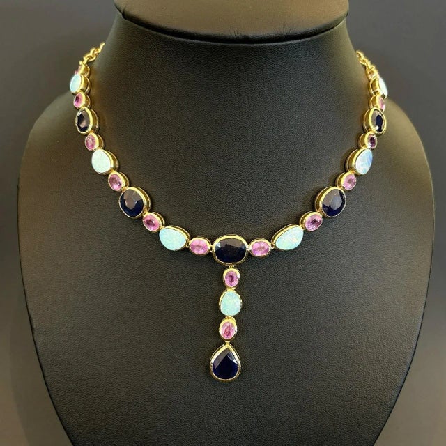 This is part of Chairish’s Fine Jewelry assortment. Natural Red Ruby 20 Carats Blue Opals - 8 Carats Natural Sapphires -...