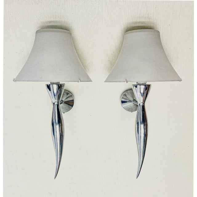 A set of Wall Lights Maison Lucien Gau from the 1980s, made of cast aluminum with the authentic white satin glass...