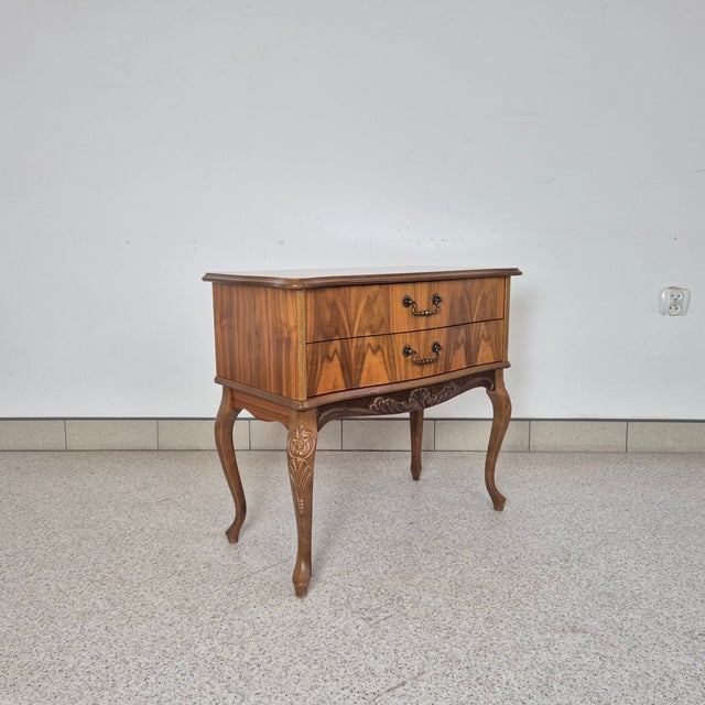This walnut-veneered chest of drawers was produced by Bleie Møbelfabrikk in Norway in the 1970s. The piece stands out with...