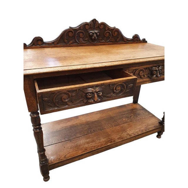 Victorian Gothic Oak side table, decorative carved round 1920. Green Mask decoration