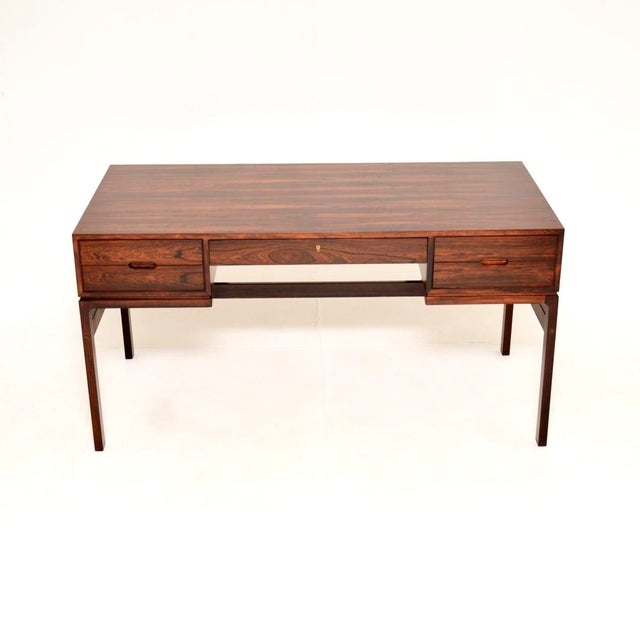 A stunning and extremely well made vintage Danish desk by Arne Wahl Iversen. It was made in Denmark by Vinde Mobelfabrik,...