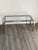 Design coffee table in chrome and glass made in Italy, circa 1970. In the style of Cy Mann.