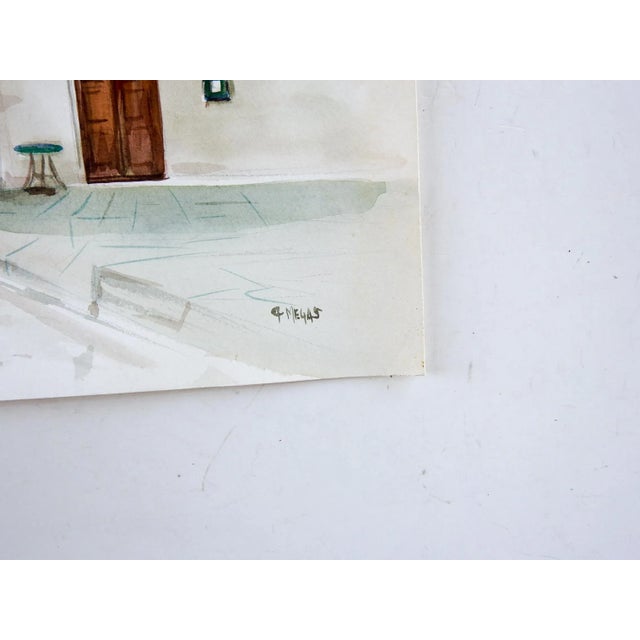 Watercolor on paper of Mediterranean village street scene. Signed Megas lower right corner. Unframed.