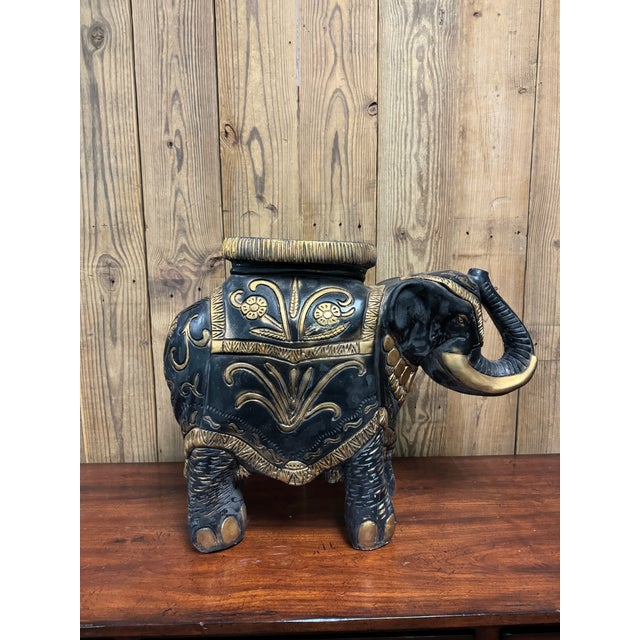 A painted black and gold Chalkware elephant plant stand is perfect for a plant or to use by a chair for a drink! It is...