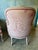 Lovely pair of 20th century French bergere chairs. Upholstered in a pinky red Toile De Jouy fabric with down cushions.