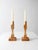 Pair of handmade wooden candlesticks with faceted stems, square bases, and a natural wood finish. Their clean sculptural...