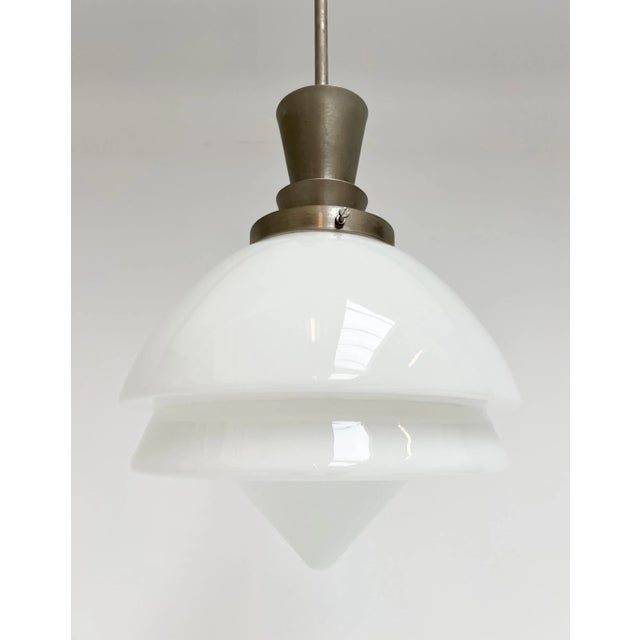 Large giso ceiling lamp by dutch designer w.h. Gispen. An art deco lamp dating from the 1950s. The lamp features a matte...