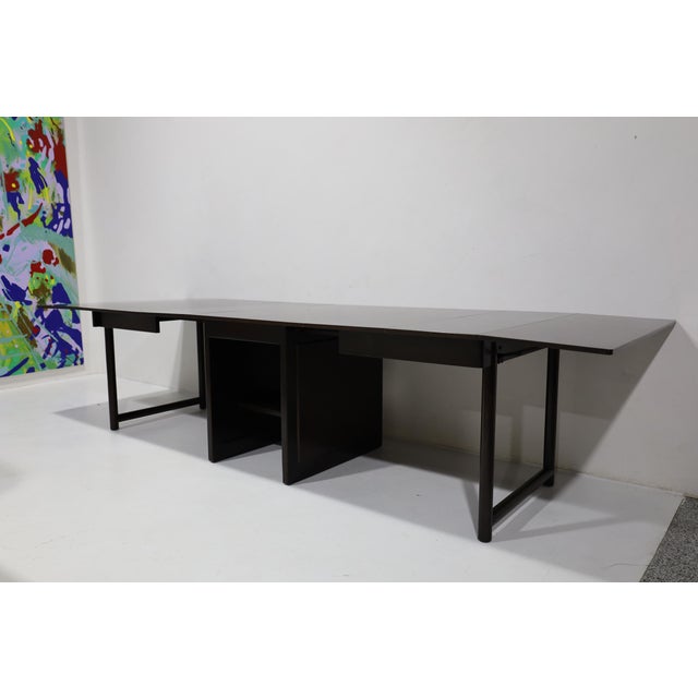 Designed by Edward Wormley for Dunbar, this beautiful mahogany dining table extends to 126 inches. The drop leaf table...