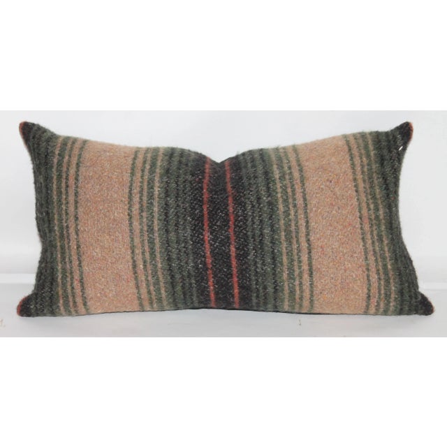 Earth toned striped bolster pillow in great condition. This earthy wool pillow has been professionally laundered and has a...