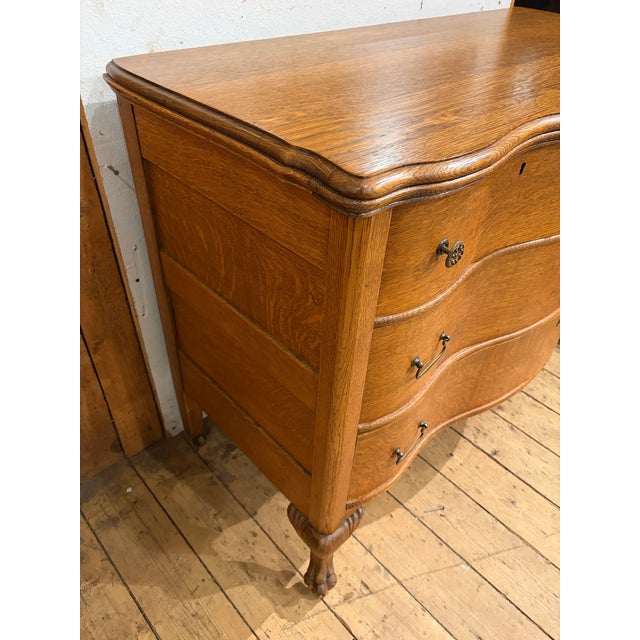 Up for sale in Sunapee Harbor is an antique Victorian oak bedroom dresser with a serpentine style front. This truly is a...