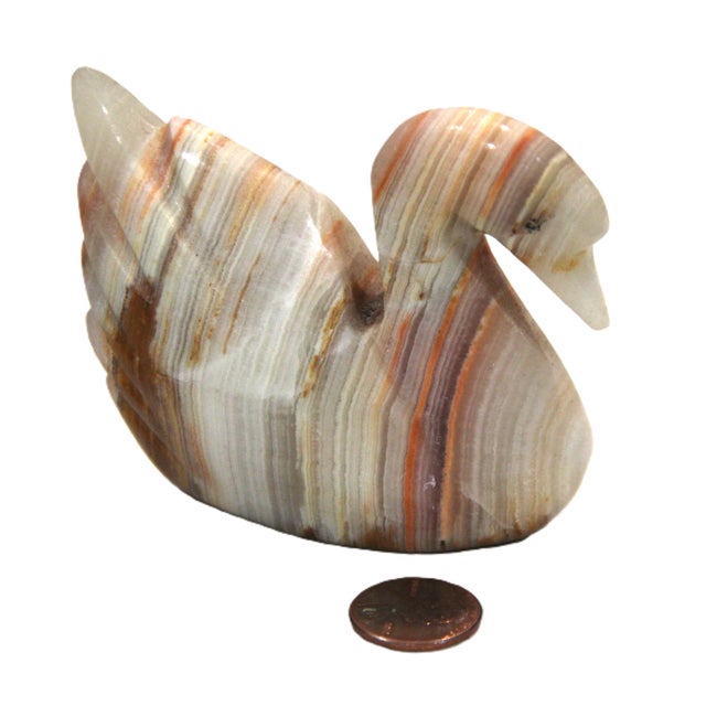 Fantastic hand carved marbled onyx swab figurine in excellent condition. This little sweetie will fit nicely in any decor...