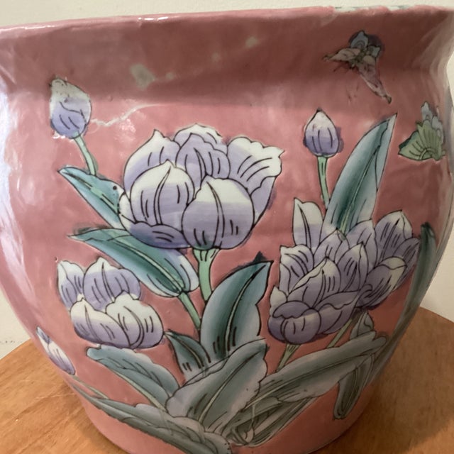 This vintage chinoiserie large porcelain koi fish-bowl planter features a beautiful floral motif, showcasing an Asian...