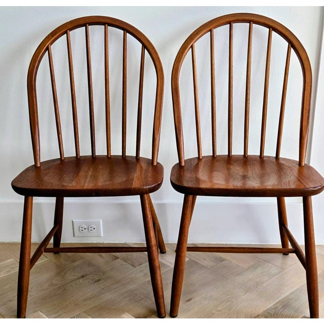 Elevate your space with this stunning pair of authentic mid-century Danish Modern Windsor chairs, expertly crafted by Tarm...
