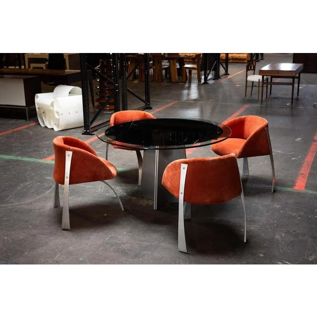 These Model P80 dining chairs, designed by Giovanni Offredi and manufactured by Saporiti Italia in 1973, are a striking...