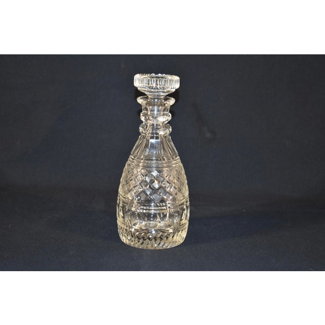 Circa 1930's cut glass decanter with original stopper. The design is very detailed and has lots of faceted edges and...
