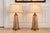 An exceptionally elegant pair of vintage Neoclassical obelisk table lamps featuring beautifully aged antiqued mirror...