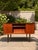 A beautifully designed Danish modern teak writing desk in the style of Arne Vodder, made in Denmark, circa 1960s. The desk...