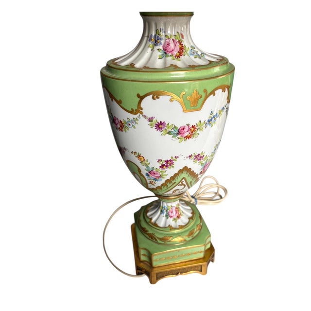 Exquisite late 19th C Sevres style lamp. Hand painted and hand gilded with a deep layer of hand painted gold. Base is...