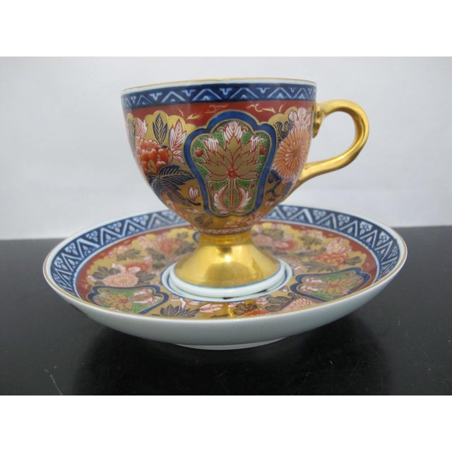 Japanese Arita ware Imari porcelain cup and saucer with a Gokunishiki Kinsai Koimari style design produced by Kisen Kiln...