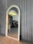 Bring home a true design classic from the 1970s. This arched mirror combines timeless retro aesthetics with clever...