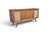 A striking blend of iconic Mid-Century Modern design and exceptional craftsmanship, this restored walnut stereo console is...