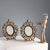 Pair of gilded bronze table mirrors with leafy scroll decorations. This piece is attributed to the mentioned...