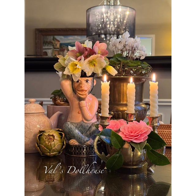 A Mid-Century centerpiece taper candle holder made in India. It holds three candles and features a hand cut lotus form...
