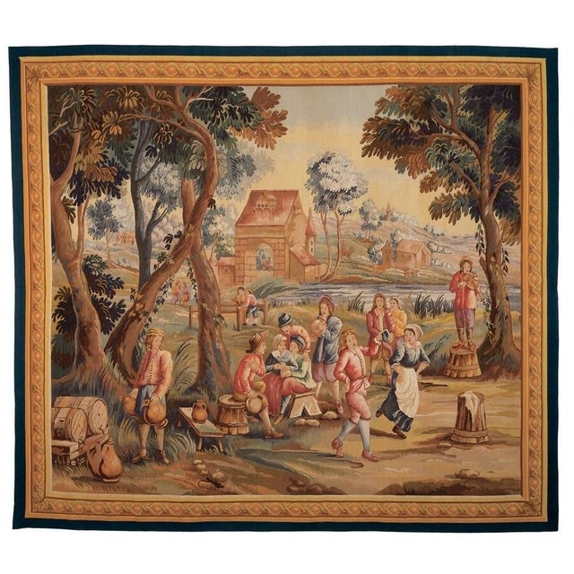 Woven at Brussels in the 18th Century from an original 17th Century design, this scene depicts village life and a rustic...