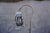 Rustic wrought iron hanging lantern floor lamp, circa 1920s, featuring a beautifully aged hand-forged form with an elegant...