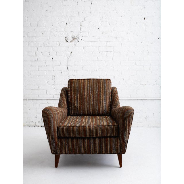 Mid-century lounge chair in striped upholstery in the style of Harvey Probber. Some stiffening to the foam but still...