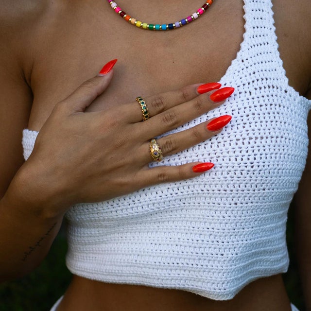 The Golden Sunburst Multi Gemstone Adjustable Ring shines with radiant energy and timeless elegance. Featuring vibrant...