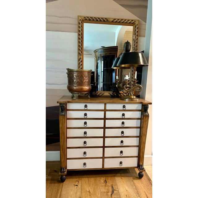 Mid-Century mirror, hand-crafted with open-twist braided carvings intertwined with a subtle aged-brass pole inlay, made in...