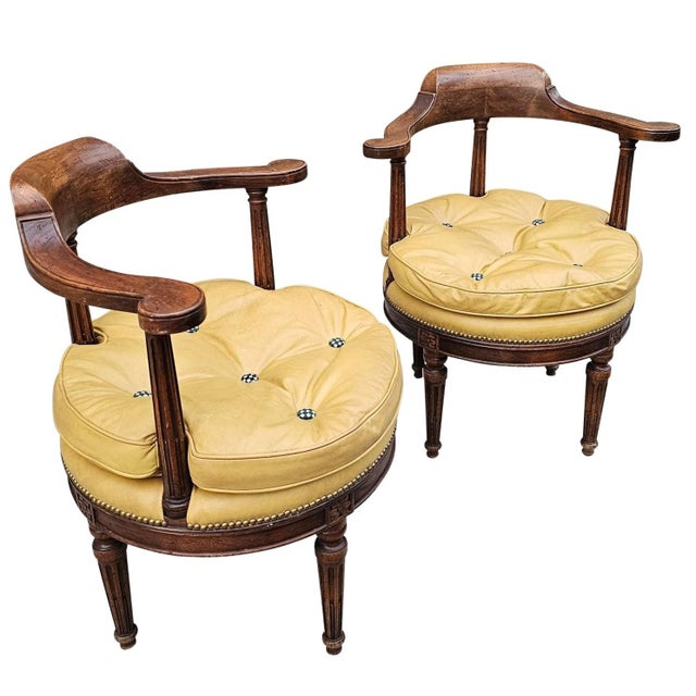 This Antique Pair of French Louis XVI Style Swivel Desk Chairs are unique, with a lustrous patina of their aged wood and...