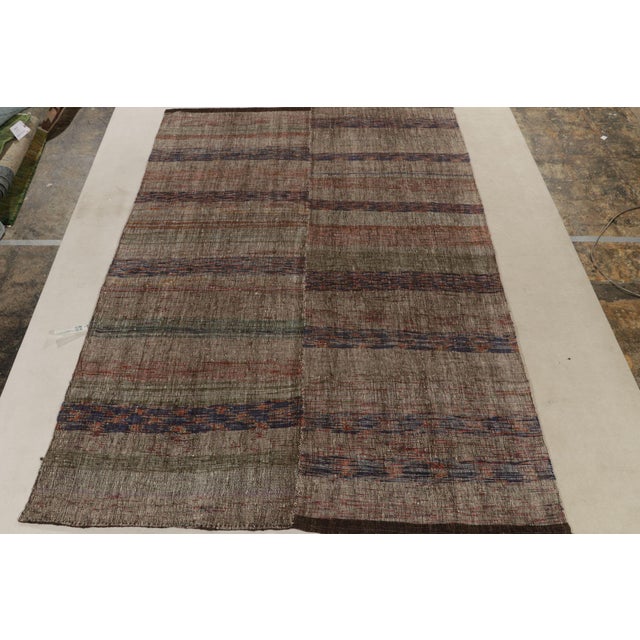 A 7x10 vintage panel woven kilim rug from our celebrated flatweave curations. Originating from Turkey circa 1950-1960, the...