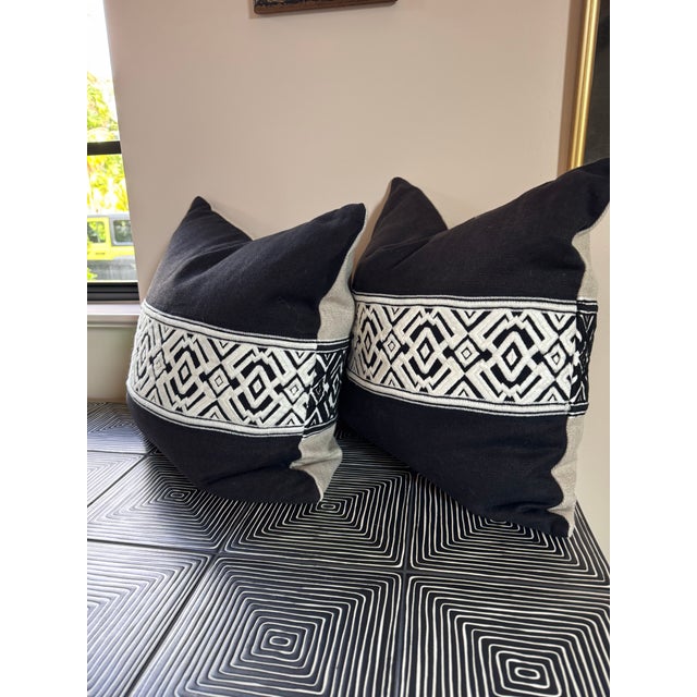 Gorgeous linen pillows reversible design with opposing black and white tape by Schumacher. A steal!