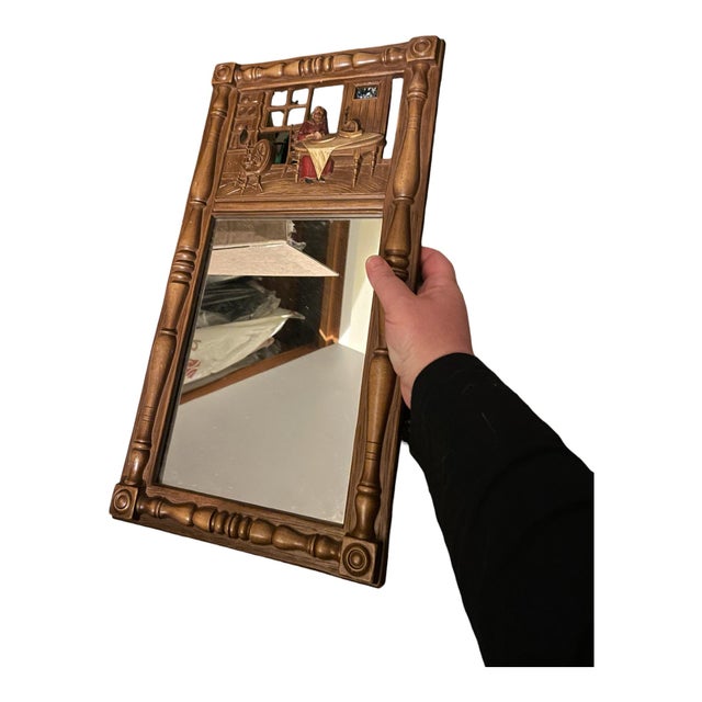 Vintage midcentury hanging wall mirror made by Syroco in the 1950s or 60s as part of their Colonial/Early American Revival...